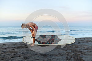 Surfer. Surfing Man On Sandy Beach Going To Surf On Surfboard In Beautiful Ocean. Water Sport For Active Lifestyle