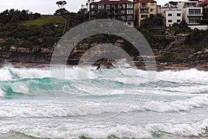 a surfer is surfing in the ocean on top of waves