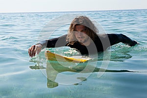 Surfer surfing in the sea