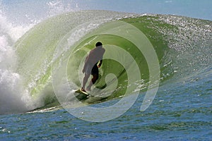 Surfer Surfing a Tubing Wave photo