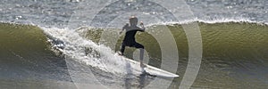 Surfer surfing on a wave at the beach