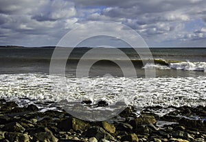 Surfer surfs a perfect wave on a sunny day