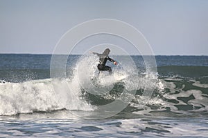 Surfer on top of the wave