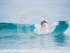 Surfer on top of the wave.