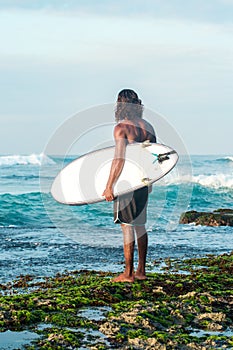 Surfer waits for a wave