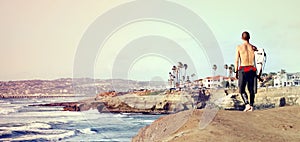 Surfer watching waves