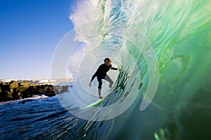 Surfer on Wave at Sunset