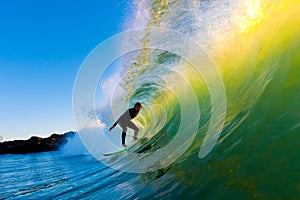 Surfer on Wave at Sunset photo