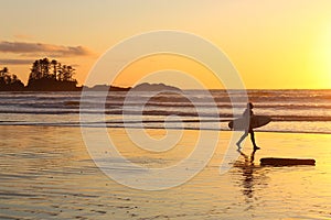 Tofino, Vancouver Island, End of the Day, Surfer Leaving Chesterman Beach at Sunset, British Columbia, Canada