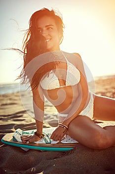 Surfer woman in swimsuit bikini. Summer, holidays on the beach