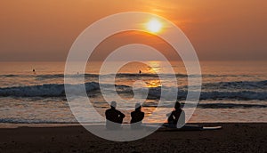 Surfers Admiring the Sunset