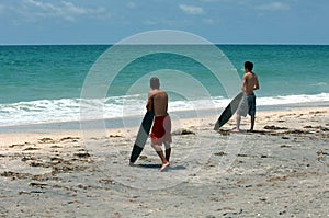 Surfers on beach