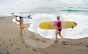 Surfers with board
