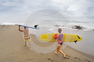 Surfers with board