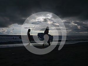 Surfers in Canggu, Bali before the storm