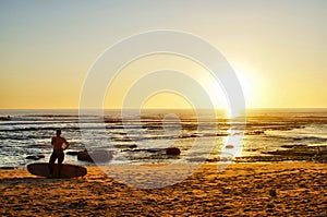 Surfers Coming in at Sunset