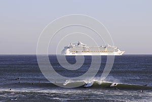 Surfers and Cruise Ship on the Horizon