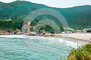 Surfers ctching the waves early in the morning at Big Wave Beach in Hong Kong  - 3