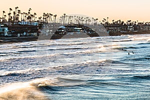 Surfers at Dawn in Oceanside, California