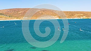 Surfers doing windsurfing at Turkey's world famous Cesme Alacati Beach