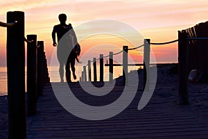 Surfers at dusk