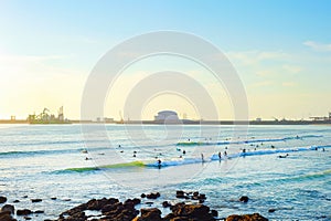 Surfers Matosinhos Leixoes Port sunset photo