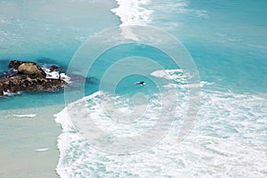 Surfers at Noordhoek Beach photo
