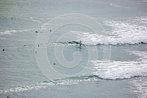 Surfers in the Pacific Ocean in Lima, Peru