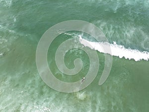 Surfers Paddling Out