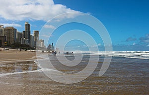 Surfers Paradise or the Gold Coast, Queensland Australia, People on the beach and in the ocean by the city