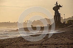 Surfers and People at Echo Beach in Canggu Bali Indonesia in sun