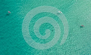 Surfers are seen from above