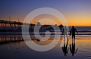 Surfers Silhouettes at the Imperial Beach Pier Sunset