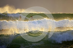 Surfers on sunset