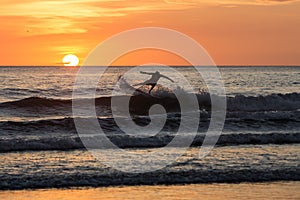 Surfers in the sunset at Playa negra, Costa Rica