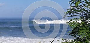 Surfers Surf a Large Winter Swell at Weimea Bay In Oahu Hawaii