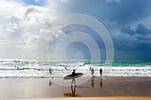 Surfers surfboards beach group Portugal