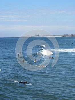 Surfers take on waves