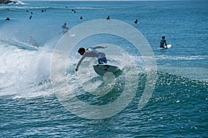 Surfers waiting for Wave and surfing