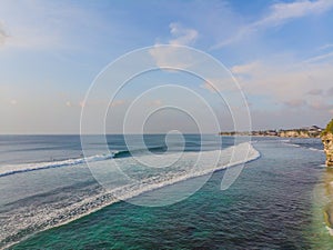 Surfers on the waves in the ocean, top view