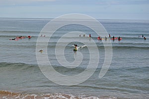 Surfers on Zumaia beach, GuipÃºzcoa, Spain