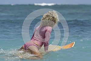 Surfgirl in pink bikini