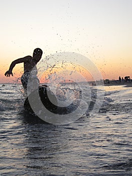 Surfing in the beach