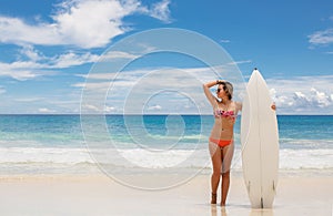 Surfing beautiful woman on the beach