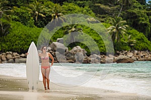 Surfing beautiful woman on the beach photo