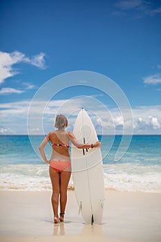Surfing beautiful woman on the beach photo