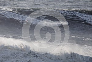Surfing Big Waves in North Beach, Nazare.