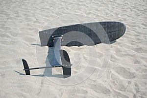 Surfing foil board in sand
