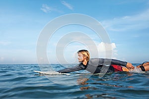Surfing. Handsome Surfer On Surfboard Portrait. Guy In Wetsuit Practicing In Ocean.