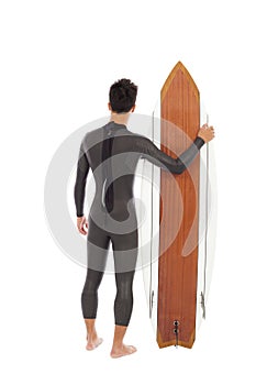 Surfing man wore wet suit and holding surfing board